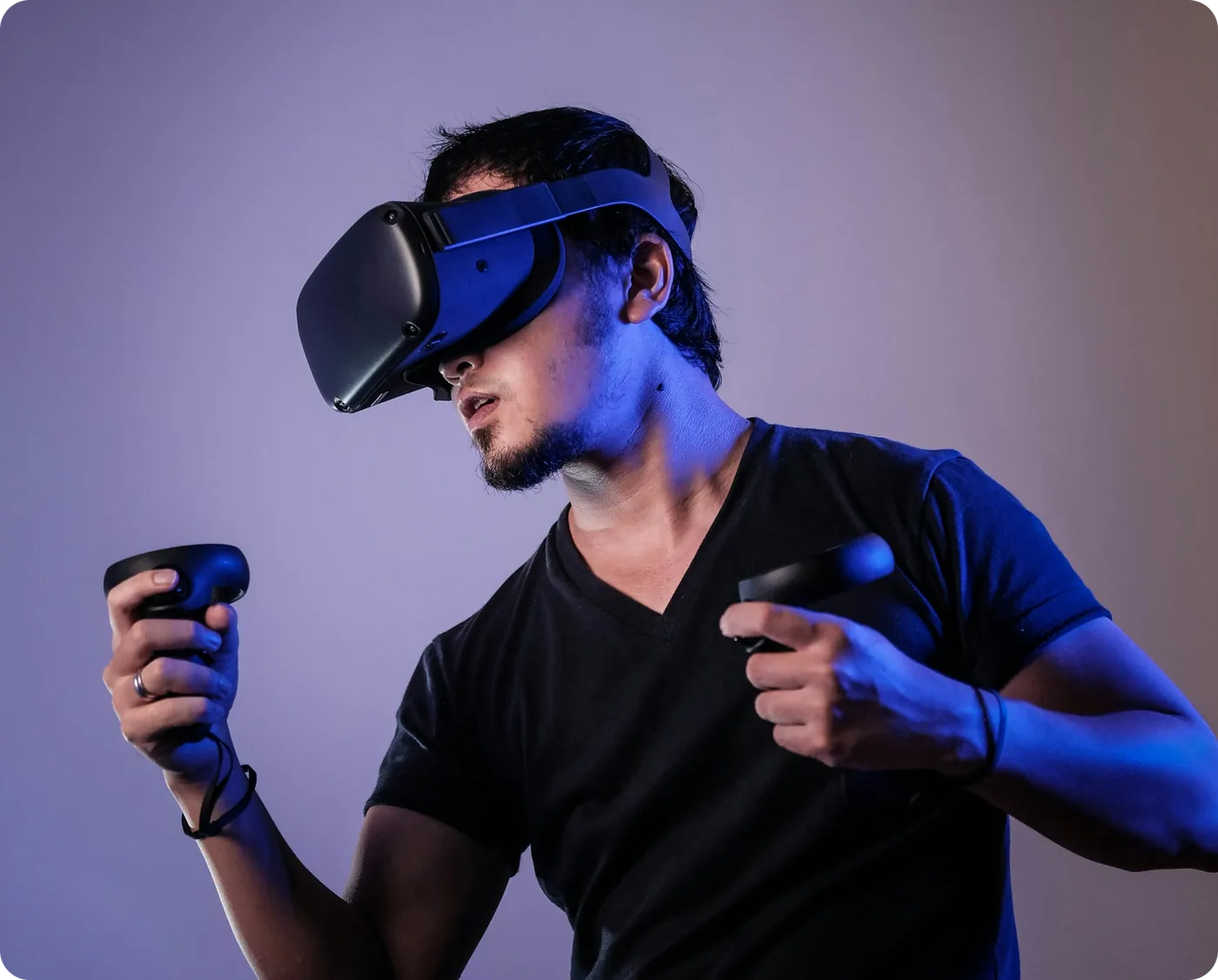 Person using a virtual reality headset and controllers